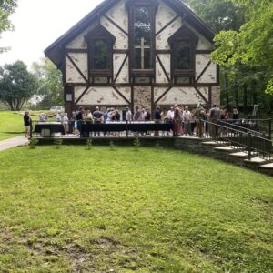 Gathering outside on the patio at The Woods Chapel