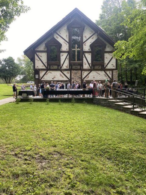Gathering outside on the patio at The Woods Chapel