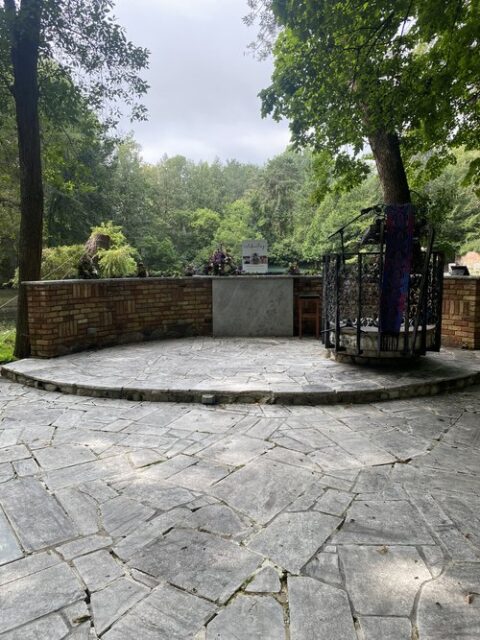 Outdoor SendOff with a serene pond in the background at The Woods Chapel